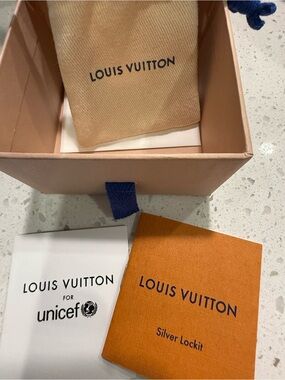 Louis Vuitton Orange Unicef Lockit Bracelet with box and pouch /paperwork